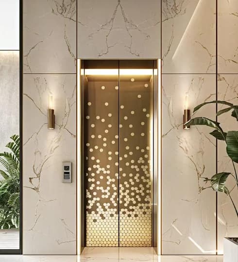 Decorative elevator door panel installation effect, showing a stylish metal finish in a modern building interior.