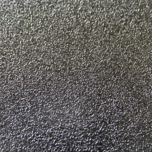 Close up texture of sandblasted stainless steel sheet showing matte finish