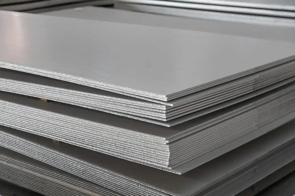 Raw stainless steel sheet before PVD coating process in manufacturing workshop