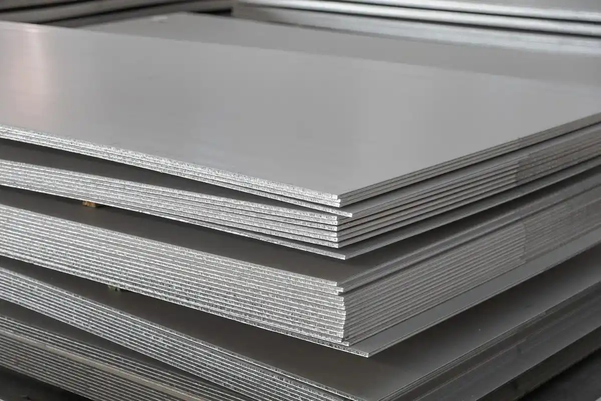 Raw stainless steel sheet before PVD coating process in manufacturing workshop