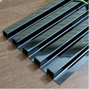 Dark blue stainless steel decorative corrugated wall panels with a rich navy hue and flowing wave texture for modern architectural accents.