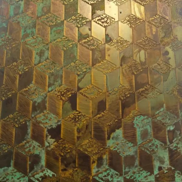 Antique stainless steel sheet with protective film showing distressed metallic surface